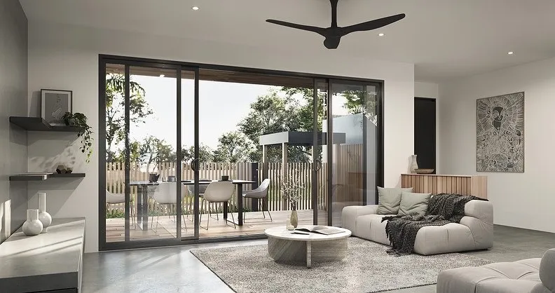 Modern living room with outdoor patio area view.
